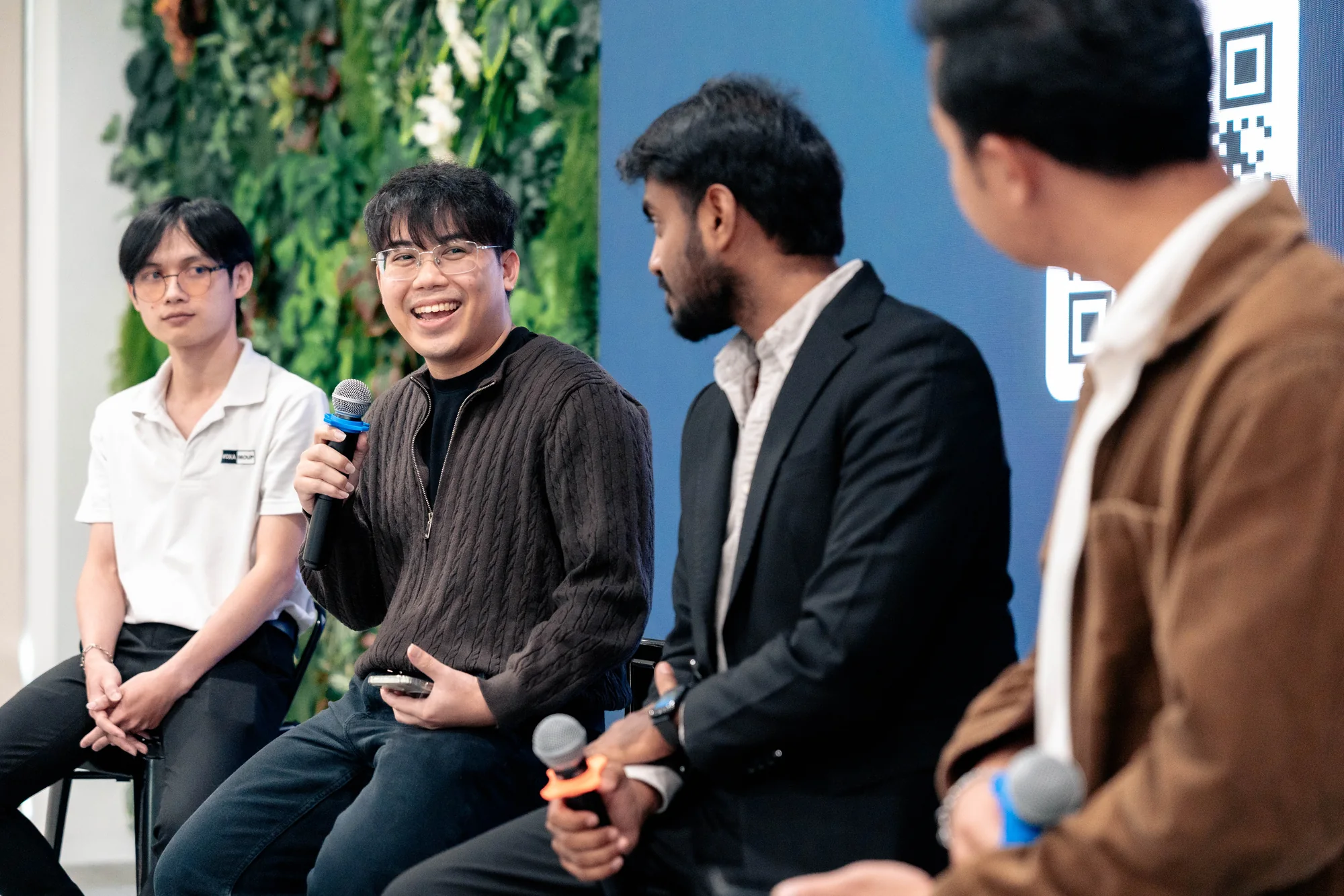Panelists discussing practical AI adoption during an internal employee session.